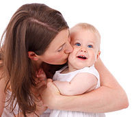 mother-kissing-baby-vera-kratochvil-wikicommons